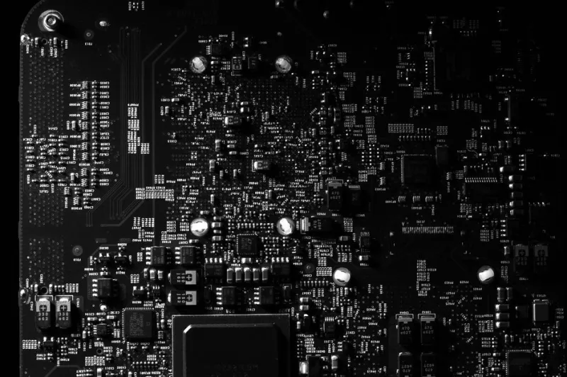 Close-up of ASIC mining hardware circuit board with chips and heat sinks used for Bitcoin mining
