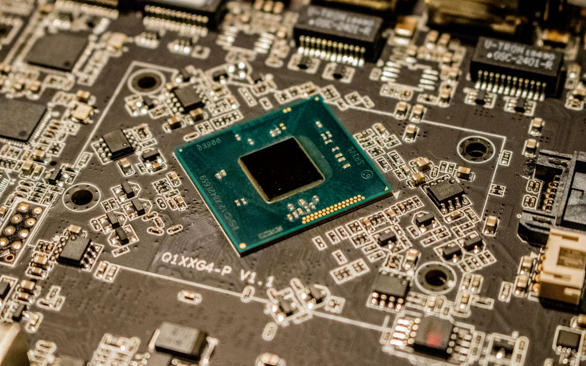 Close-up of advanced processor chip representing custom AI accelerator silicon for data center workloads
