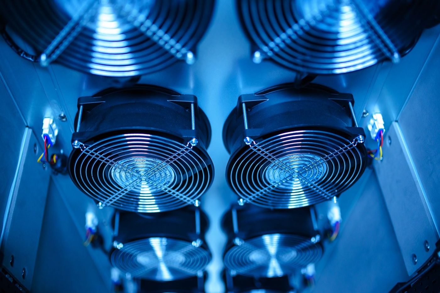 Server cooling fans in an existing air-cooled data center facing a liquid cooling retrofit
