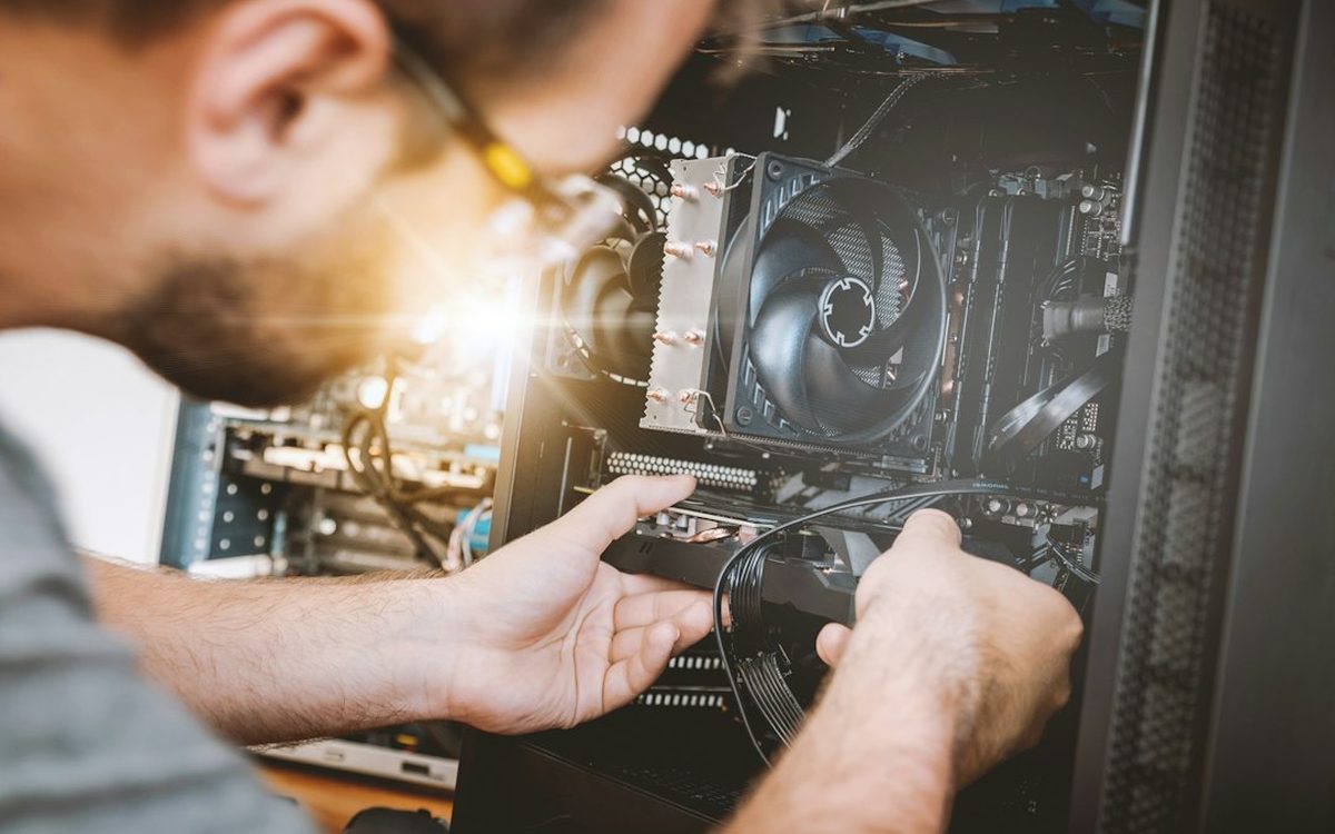 Technician working on server hardware components in a data center