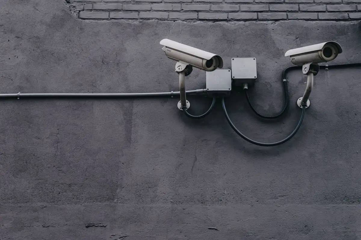 Data center physical security with biometric access control panel and surveillance cameras