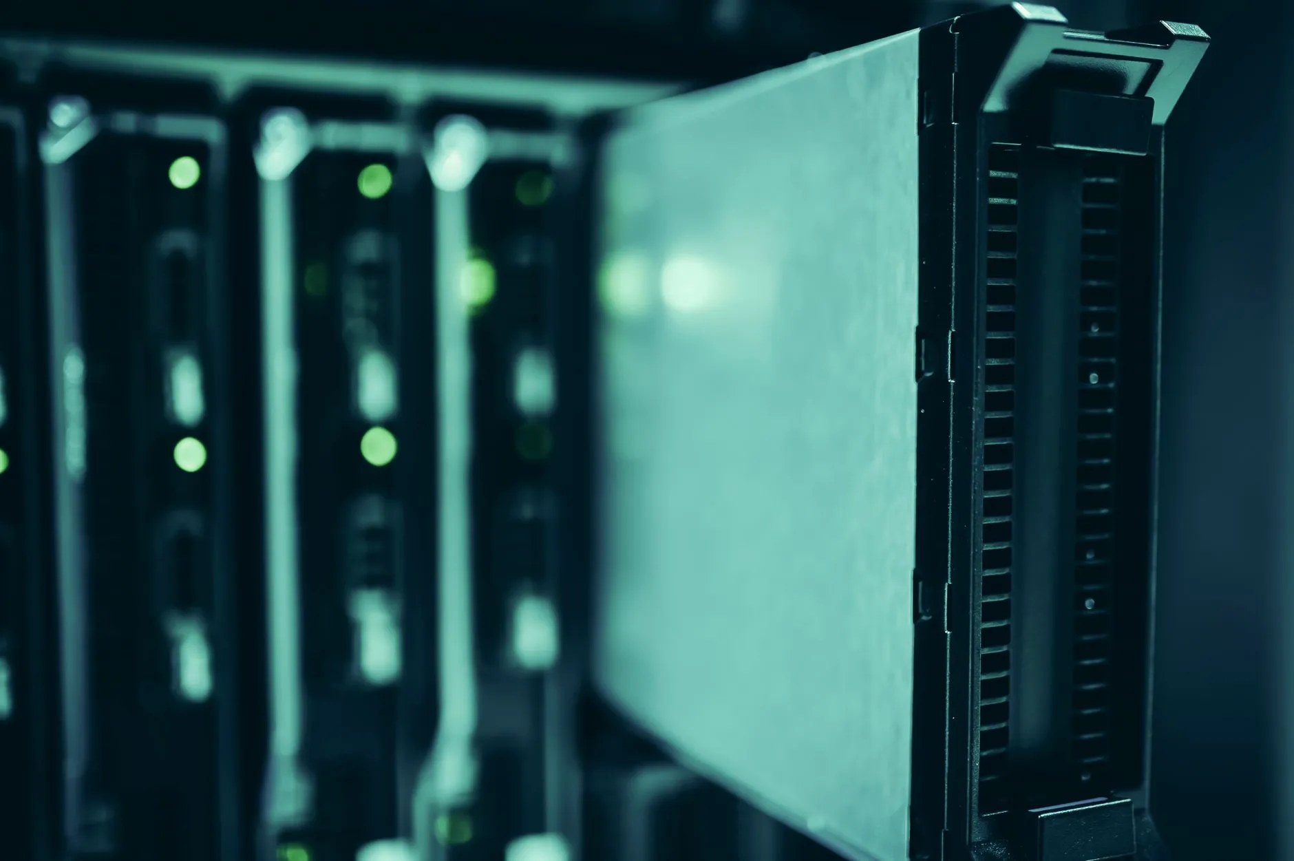 High-density server racks with blue LED lighting inside a modern data center facility