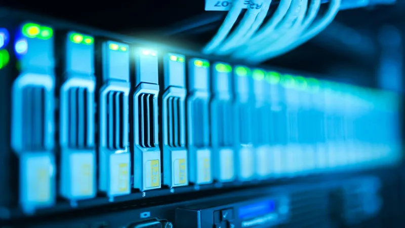 Data center interior showing server racks with structured cabling and overhead cable management systems